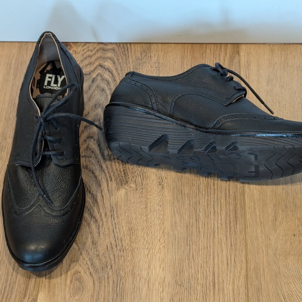 NEW!! Fly London black lace up shoes with comfortable soles. Ladies size 41.
